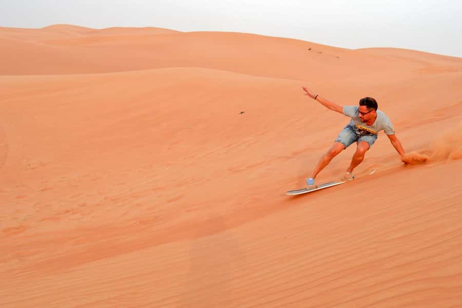 Abu Dhabi: Morning Desert Tour, Camel Ride & Sandboarding - Sandboarding: how to glide (and what to wear)