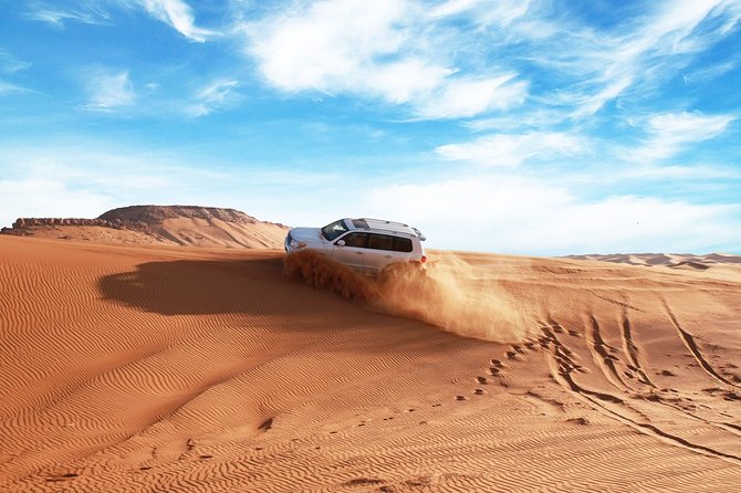 Dubai Desert Bespoke: Red Dunes Safari, Camel Ride & BBQ Options - Meeting point routine: tire prep, optional quad bikes, then the real ride