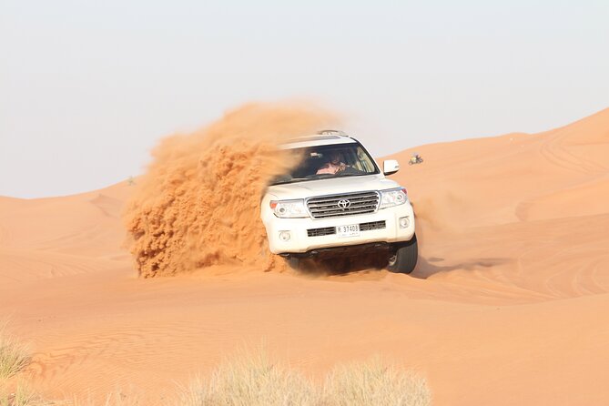 Dubai Desert Bespoke: Red Dunes Safari, Camel Ride & BBQ Options - Sandboarding: fun, but yes, you climb back up