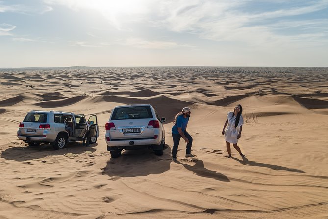 Dubai Desert Discovery: Red Dunes Safari, Sandboard & Camel Ride - Sandboarding: Beginner-Friendly Slides Down the Dunes