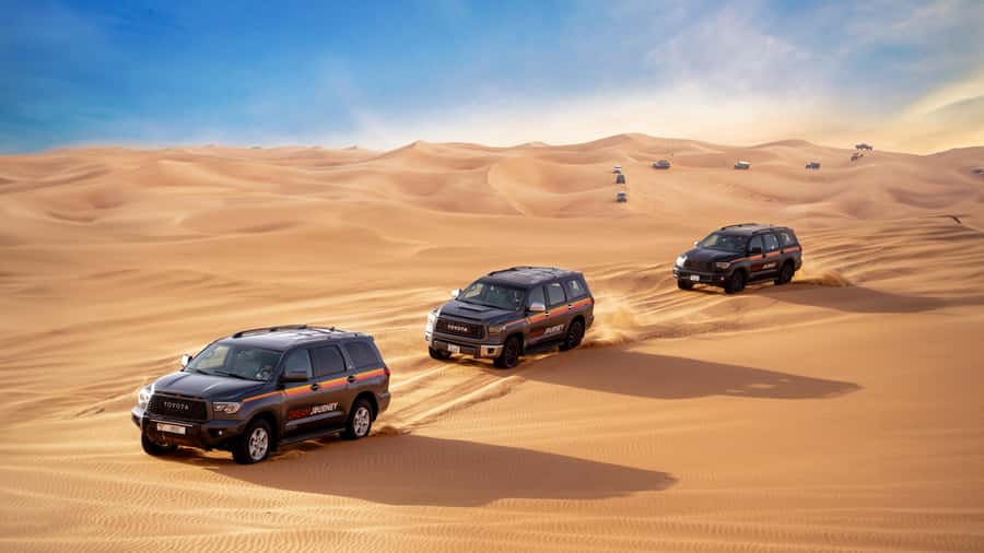 Dubai Desert Safari - Camel Ride, Sandboarding & 30 Min Quad - Sandboarding on Red Dunes: Sliding Fun Without Needing a Board-Sport Background