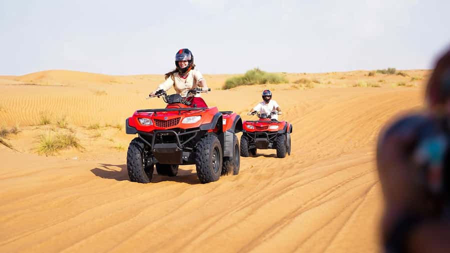 Dubai: Desert Safari, Camel Ride, Sandboarding, Quad Bike - Getting Out of Dubai: Pickup, Drive Time, and First Views