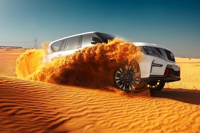 Dubai Desert Safari With BBQ, Quad Bike And Camel Ride - Camel ride, sandboarding, and fitting it all into one evening