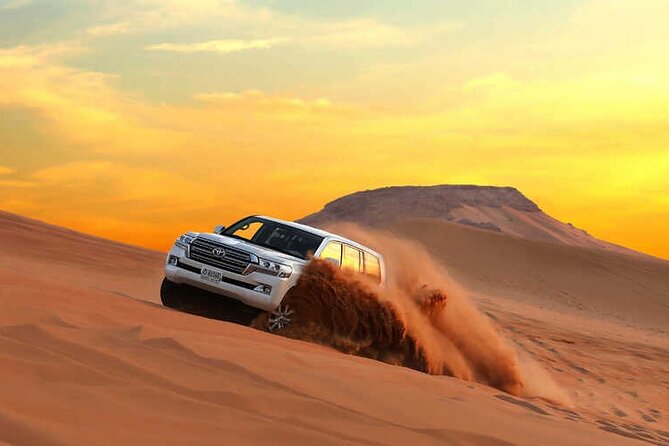 Dubai Dunes Safari With Quad Bike, Camel Ride, BBQ Dinner & Live Shows - Camel sunset photos, plus sandboarding and henna at the camp