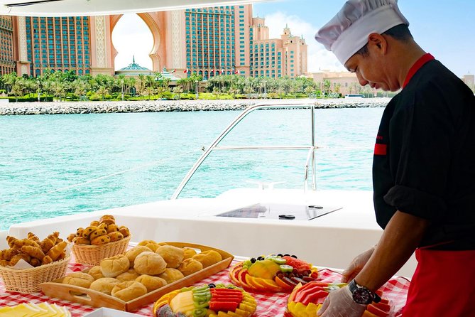 Dubai Marina Yacht Tour with Optional Breakfast or BBQ - The Palm Jumeirah: skydivers overhead and Atlantis angles