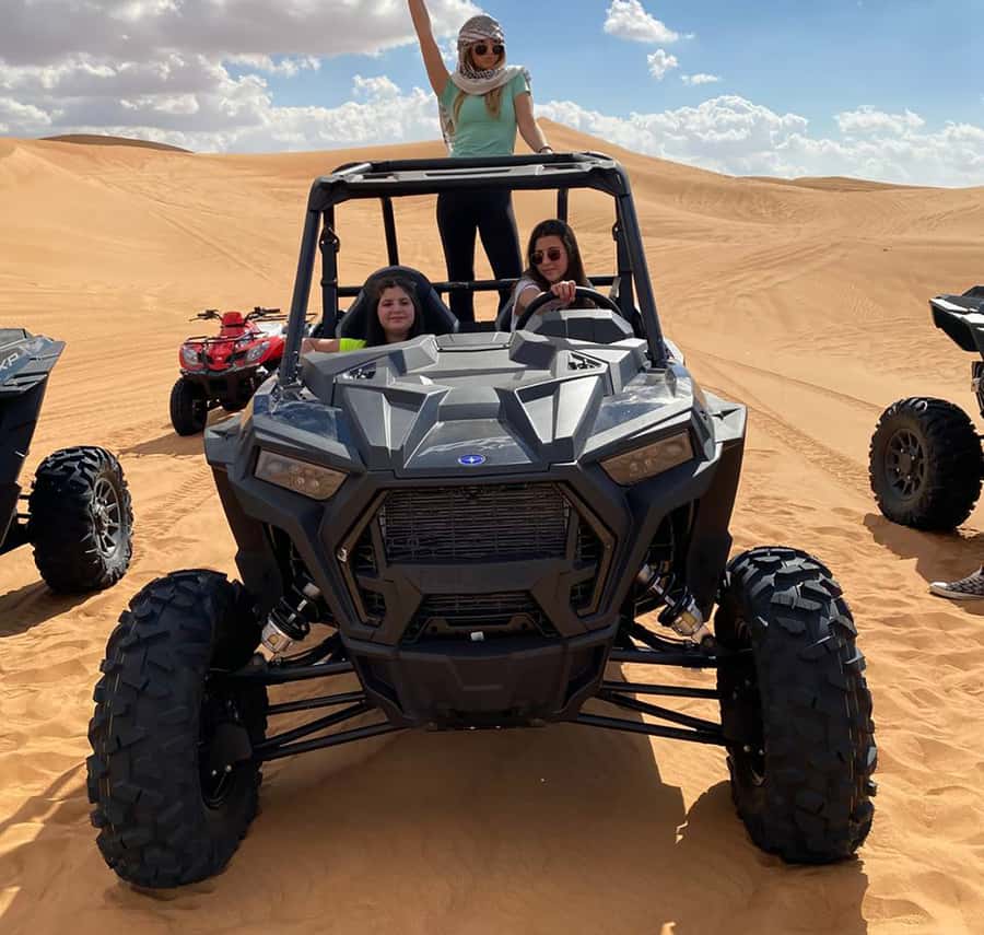 Dubai: Red Dune Desert, Dune Buggy Ride & BBQ Buffet Dinner - Sandboarding, Camel Stops, and Sunset Photo Moments