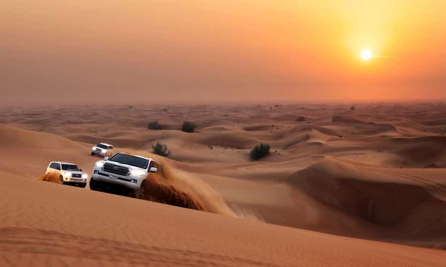 Dubai: Red Dune Desert Safari, Quad Bike, Camels, and BBQ - Camel ride at the red dunes sunset: the part that slows the heartbeat