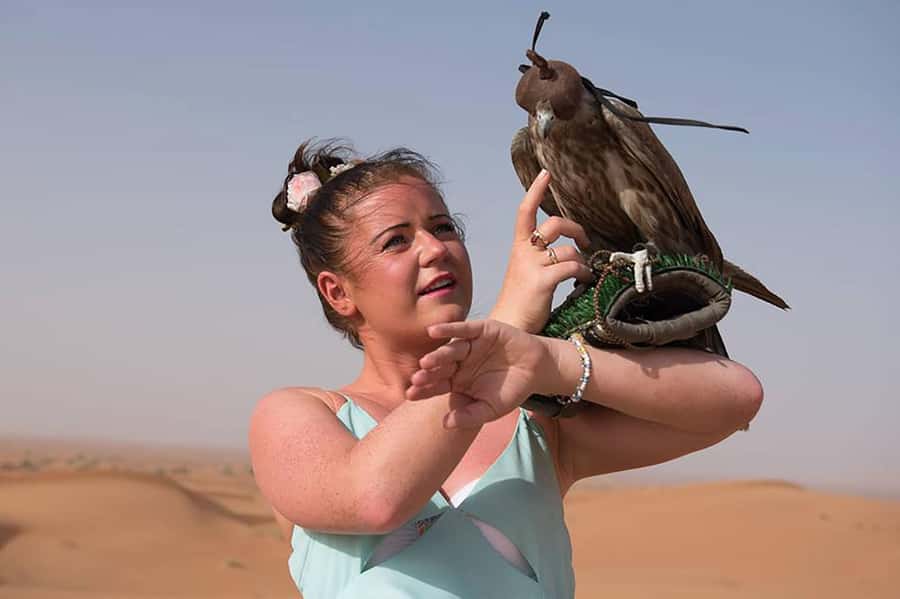 Dubai: Red Dunes Desert Safari with Premium Camp BBQ & Shows - Premium desert camp welcome: gahwa coffee, henna, and dress photos