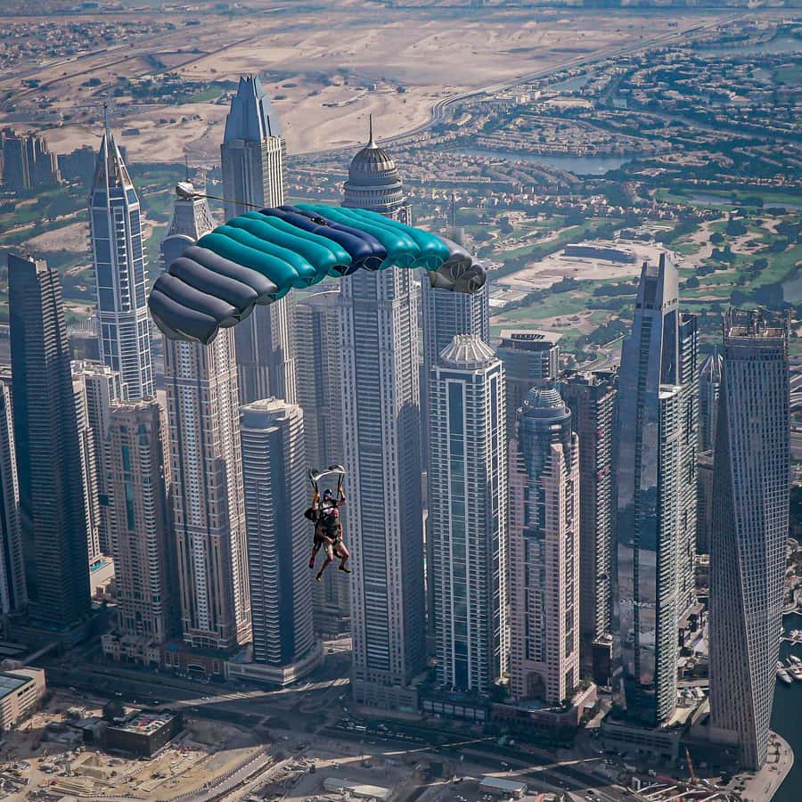 Dubai: Skydive at The Palm with Photos, Video & Yacht Tour - Parachute Ride Over Palm Jumeirah: The Part That Turns Adrenaline Into Awe