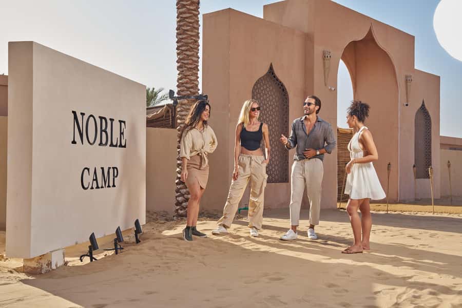 Dubai’s Best Desert Safari: Live Show & Gourmet BBQ Dinner - Noble Camp after sunset: Souq entry, henna, falcon, and hands-on fun