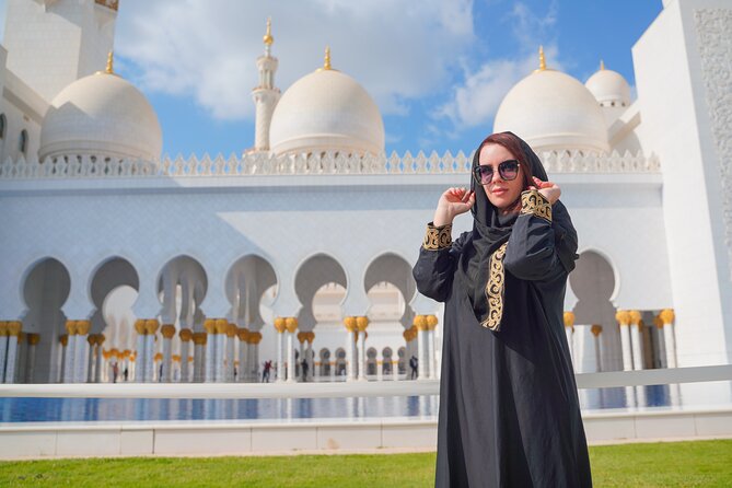 From Dubai: Abu Dhabi Sheikh Zayed Grand Mosque Guided Tour - The mosque center: the carpet, mosaic floral work, and chandelier scale
