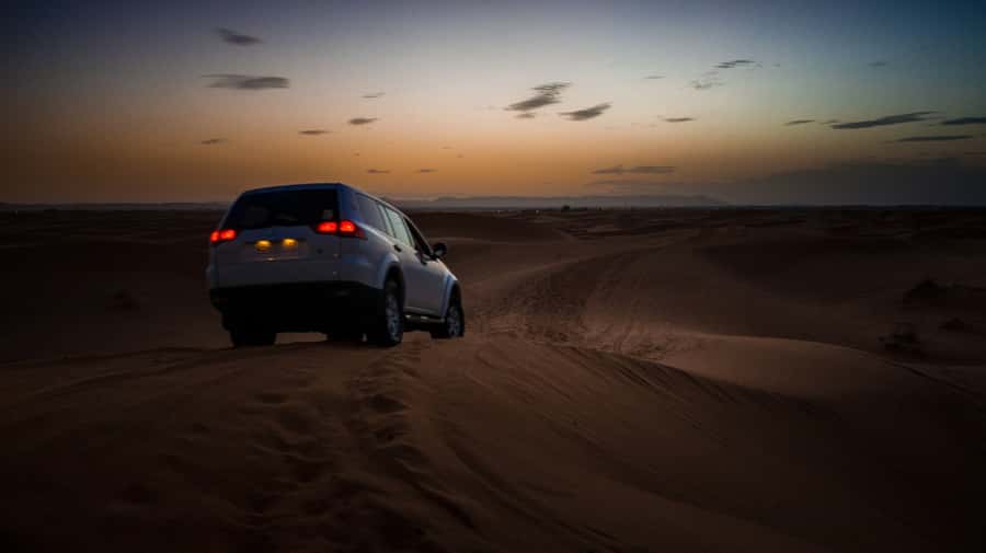 From Fez: Sahara Desert 2-Day Tour with Merzouga Camp Stay - Arriving in Merzouga: Luggage Drop and the Sunset Camel Ride