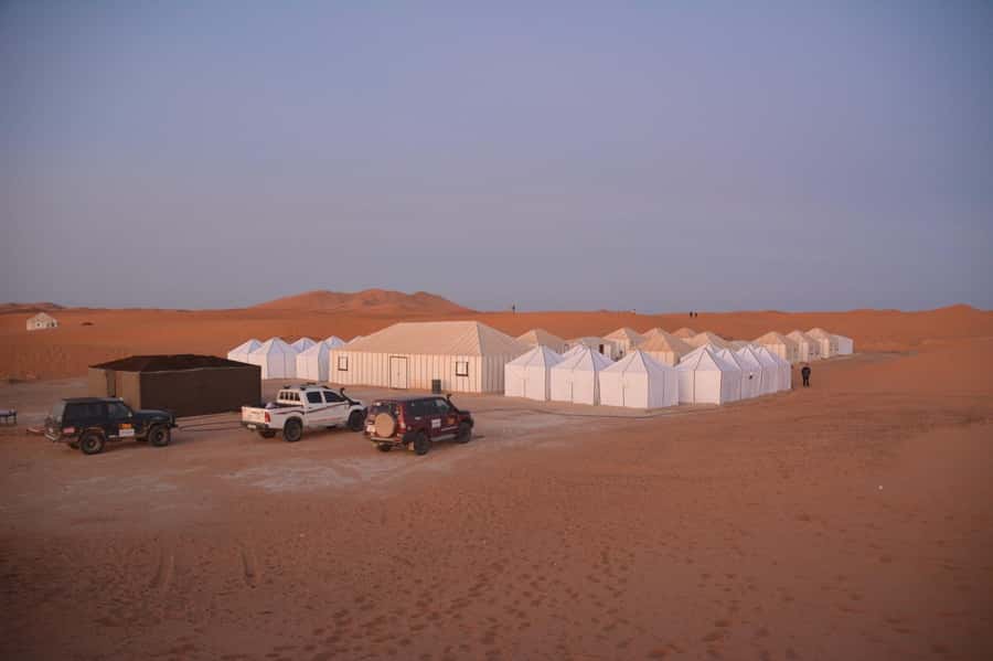 From Fez: Sahara Desert 2-Day Tour with Merzouga Camp Stay - Desert Camp Night: Private Bathroom, Dinner Under Stars, and a Fire Show