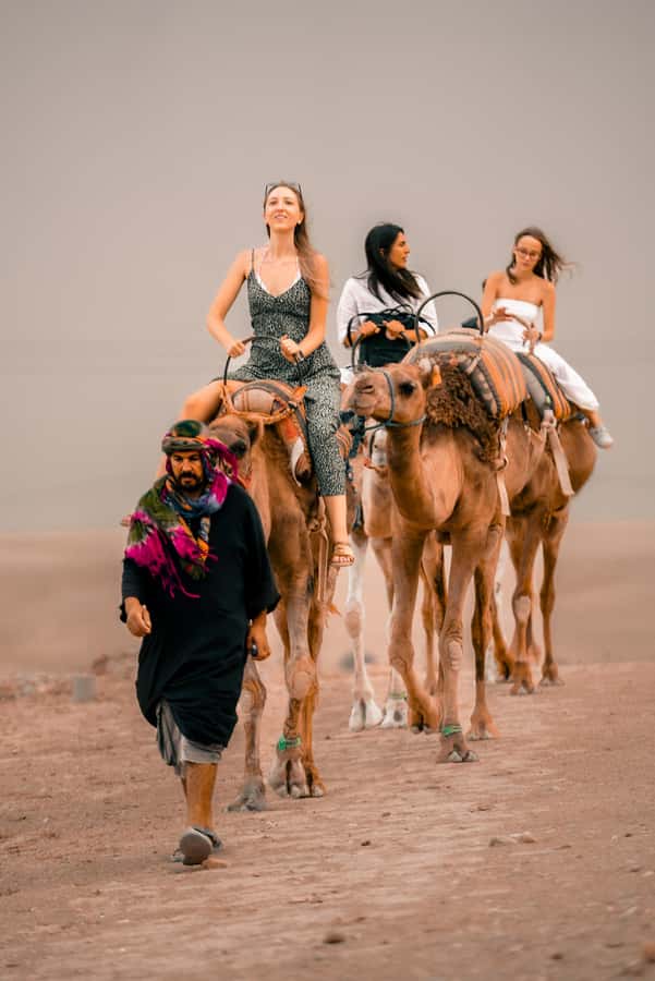 Marrakech: Agafay Desert Sunset, Camel Ride, and Dinner Show - Dinner in the Desert: Tajines, Couscous, Tea, and Berber Music