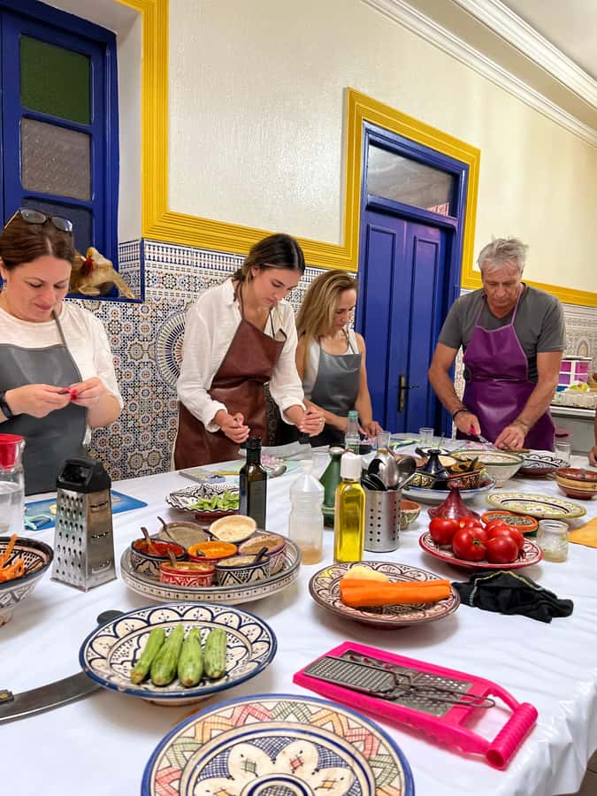 Marrakech: Traditional Moroccan Cooking Class & Market Visit - The riad workshop: Khmisa Workshops and the local women teaching the method