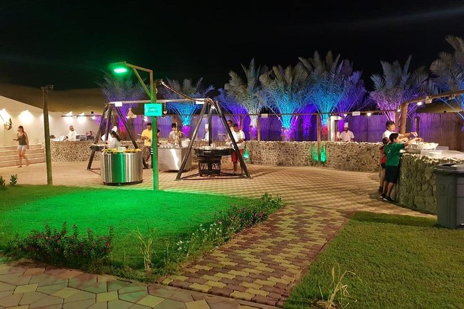 Premium Desert Safari Sharing Transfer with 5<em> Unlimited Buffet – Unlimited BBQ Dinner: How the Buffet Works and What to Expect’ /><br />
Dinner is live BBQ plus an unlimited buffet of international food. You’ll have both vegetarian and non-vegetarian options, and the buffet includes soft drinks and mineral water. Arabic coffee and tea usually happen earlier with the dates, so your meal is more of a paced evening than one long scramble.</p>
<p><p>Food quality is the biggest “make or break” variable on desert safaris, and this tour shows a clear split in feedback:</p>
</p>
<ul>
<li>Some reviews call the food plentiful, clean, and among the best at tourist camps.</li>
<li>Others described the buffet as mediocre or even horrible, plus one complaint about disgusting toilets.</li>
</ul>
<p><p>To be fair, operators sometimes improve offerings. In one response, the camp emphasized a larger buffet and said they’ve moved to a massive setup (they even mentioned about 70 dishes served daily). That suggests the food may be better than older reviews you might read elsewhere.</p>
</p>
<p><p>So how should you approach the buffet? Treat it like you’re going to sample, not hunt for a single “perfect dish.” Unlimited means you can try a little of everything and build your own best plate. Also, since it’s BBQ-style with international items, you’ll likely find something familiar even if you don’t want to gamble on spices.</p>
</p>
<p><p>Two practical ideas:</p>
</p>
<ul>
<li>Go a little earlier in the dinner window if you want the hottest items.</li>
<li>If food service at your table isn’t included (it isn’t), don’t wait for someone to bring plates. The buffet setup is meant for self-service.</li>
</ul>
<h2 id="the-shows-tanoura-fire-and-belly-dance-expect-variation">The Shows: Tanoura, Fire, and Belly Dance (Expect Variation)</h2>
<p><img src=